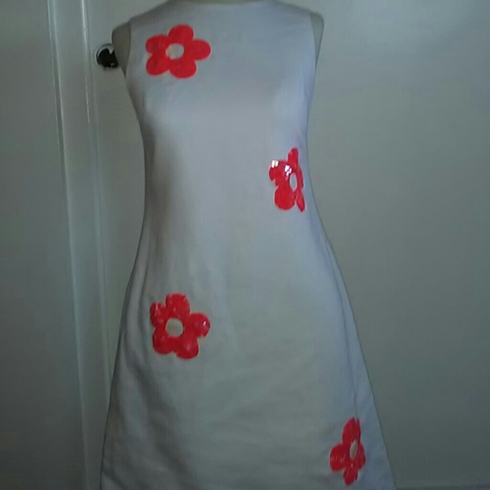 Beautiful White Dress with Orange decals.
